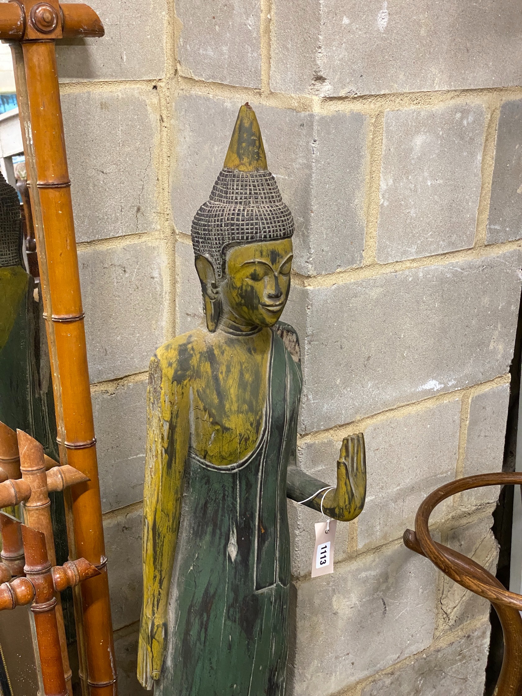 A painted carved wood standing Buddha ornament, height 116cm